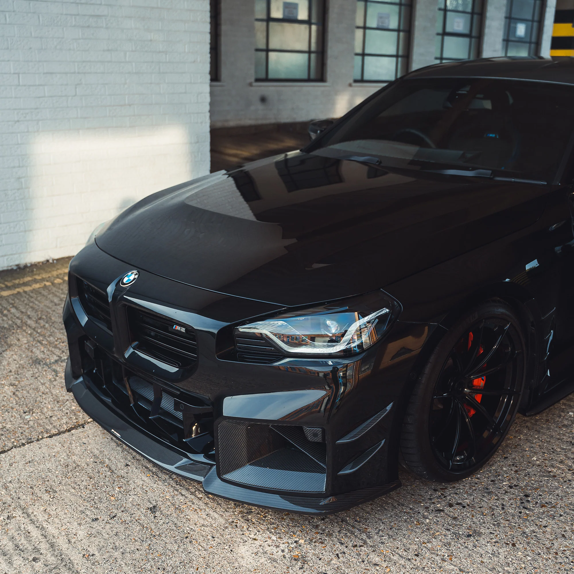 BMW G87 M2 CARBON FIBRE FRONT BUMPER CANARDS-Accessories-CT CARBON-CT Carbon - High-quality carbon fiber and gloss black aerodynamic parts for premium sports and luxury vehicles.