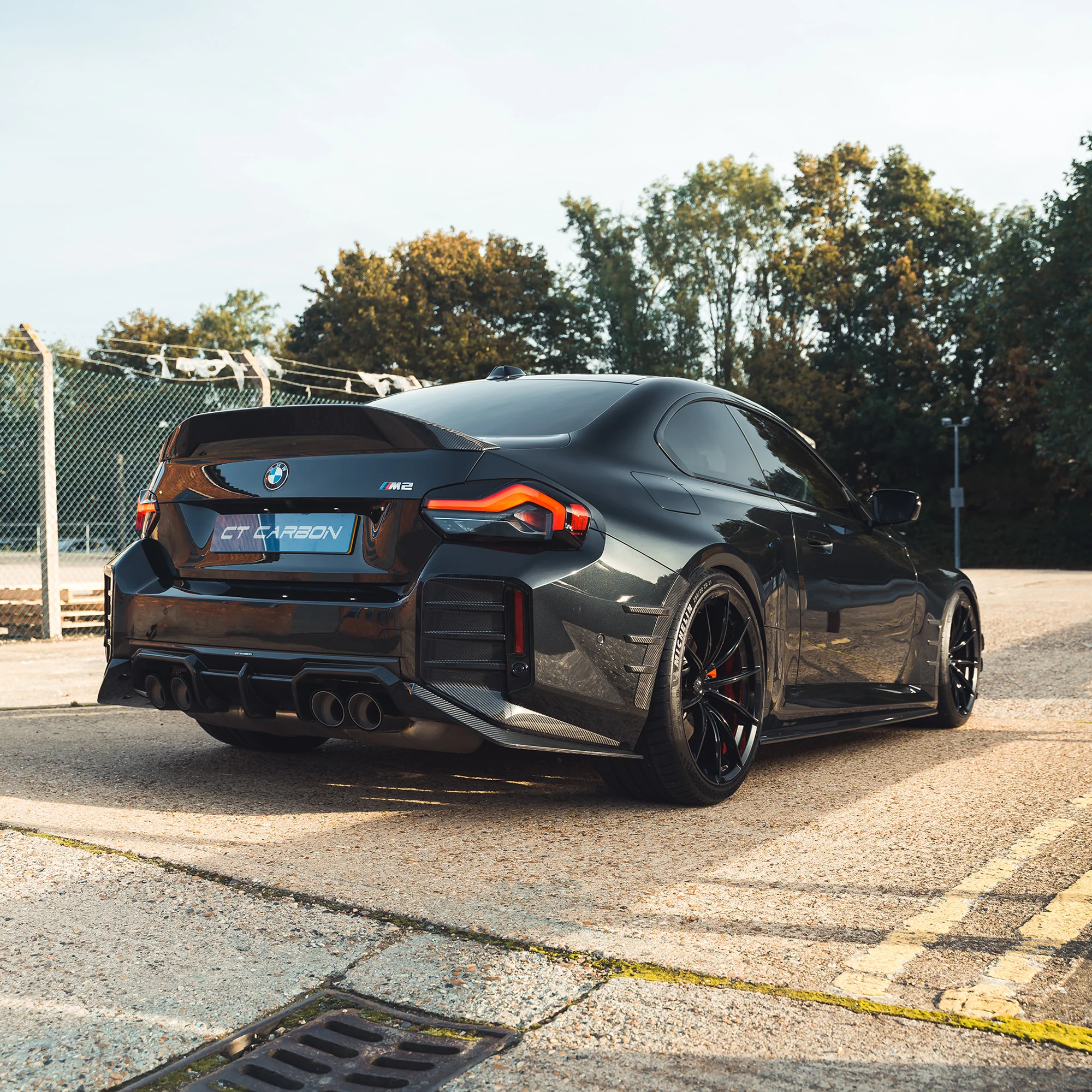 BMW G87 M2 CARBON FIBRE REAR BUMPER TRIM-Accessories-CT CARBON-CT Carbon - High-quality carbon fiber and gloss black aerodynamic parts for premium sports and luxury vehicles.