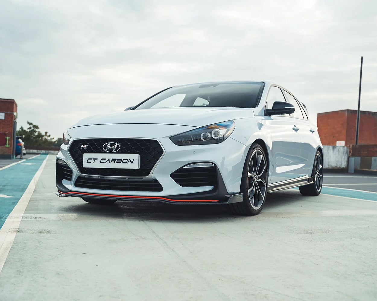 HYUNDAI i30N FRONT CARBON FIBRE SPLITTER (PRE-FACELIFT) - CT DESIGN-Splitter-CT CARBON-CT Carbon - High-quality carbon fiber and gloss black aerodynamic parts for premium sports and luxury vehicles.