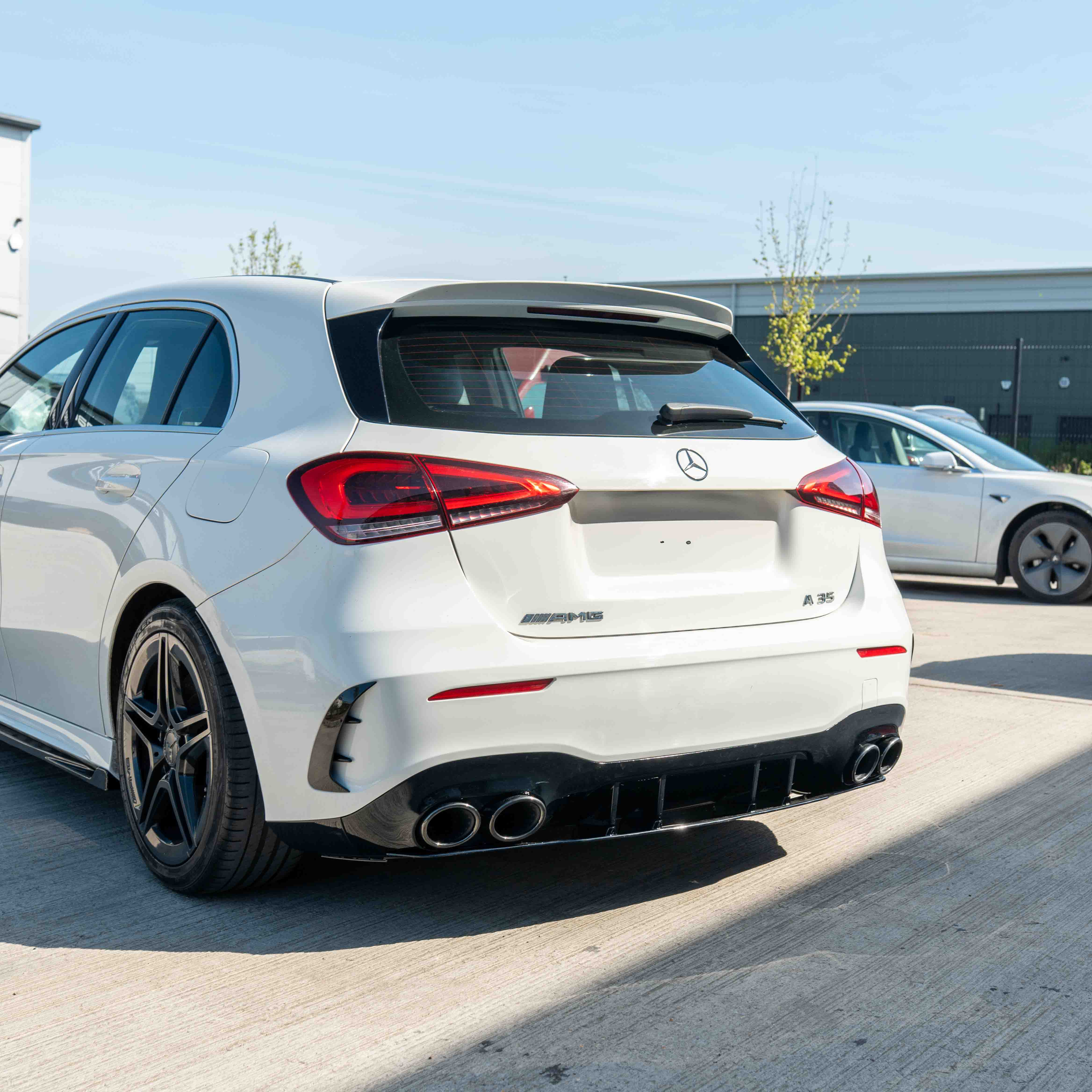 MERCEDES A-CLASS W177 2018-CURRENT GLOSS BLACK QUAD TIP DIFFUSER-Diffuser-BLAK BY CT-CT Carbon - High-quality carbon fiber and gloss black aerodynamic parts for premium sports and luxury vehicles.