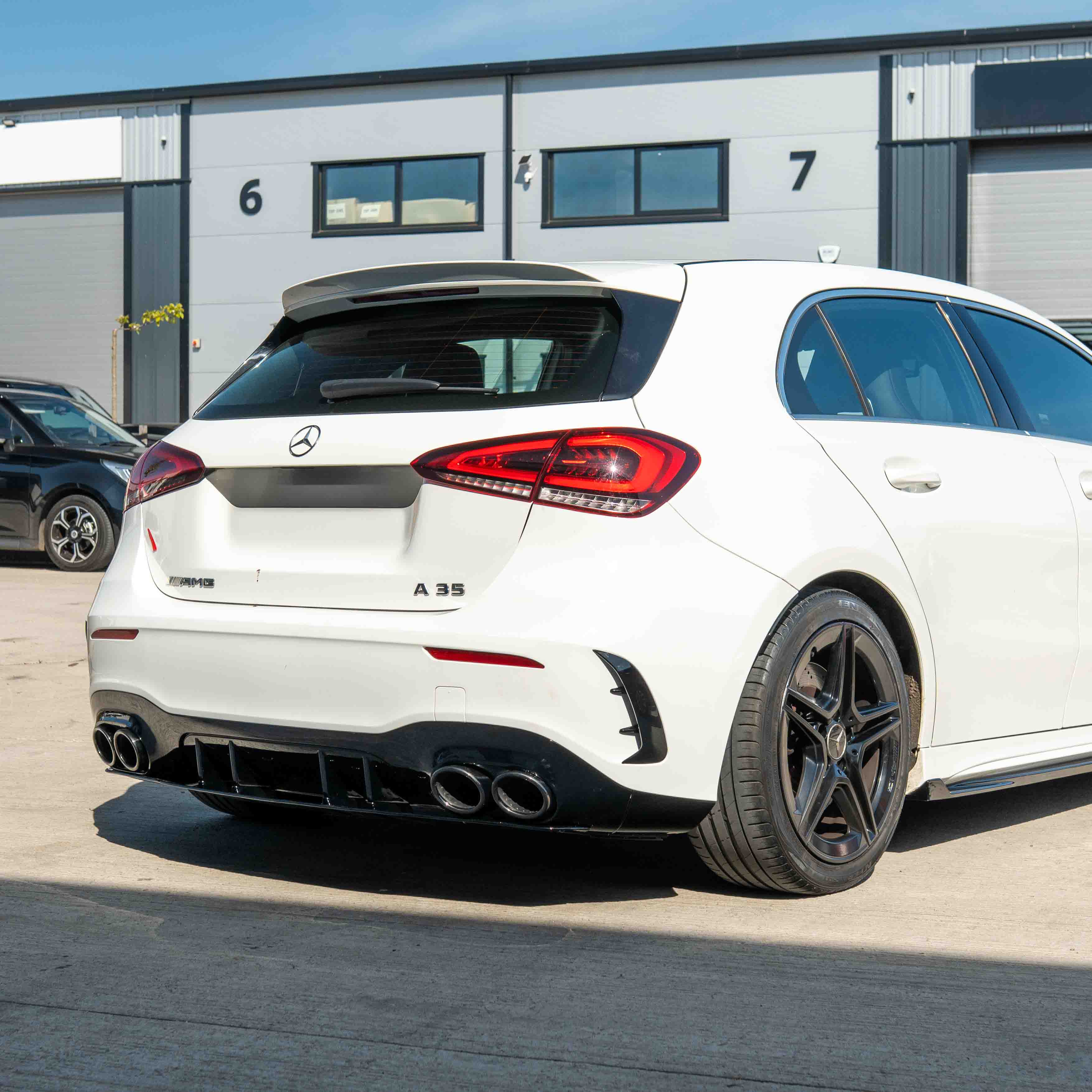 MERCEDES A-CLASS W177 2018-CURRENT GLOSS BLACK QUAD TIP DIFFUSER-Diffuser-BLAK BY CT-CT Carbon - High-quality carbon fiber and gloss black aerodynamic parts for premium sports and luxury vehicles.